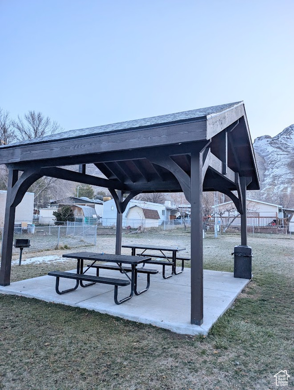 View of property's community featuring a gazebo, a yard, and fence
