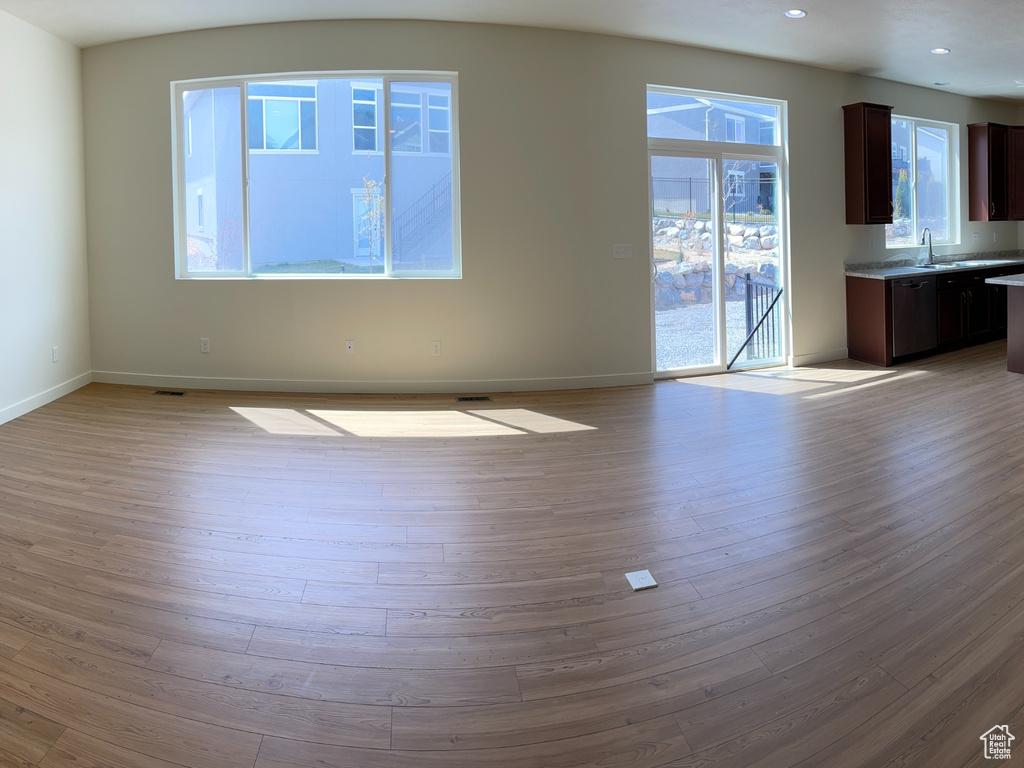 Interior space featuring baseboards and wood finished floors