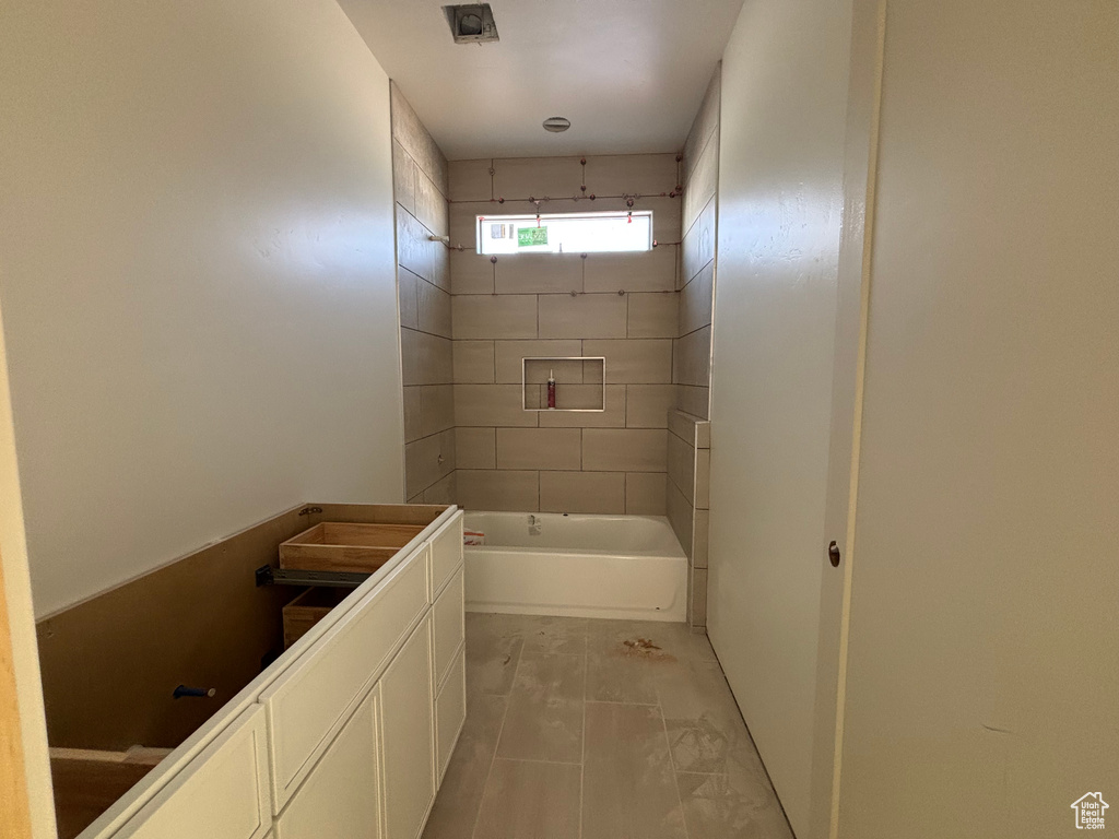 Bathroom featuring bathing tub / shower combination and vanity