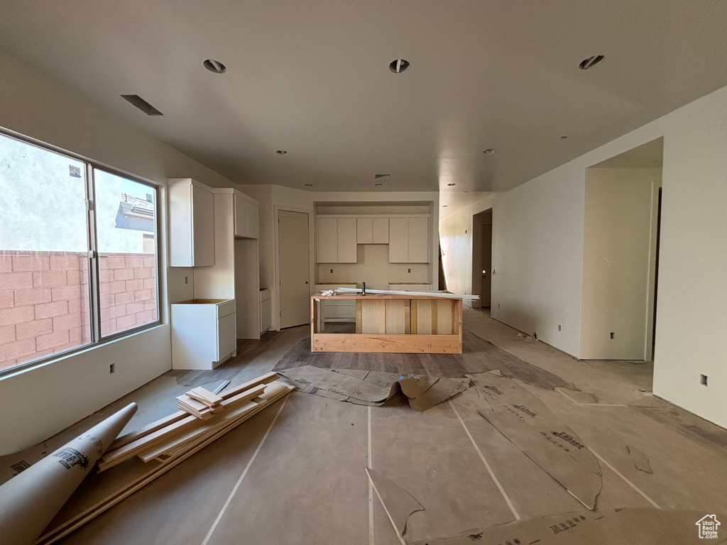 Kitchen with white cabinets and a center island