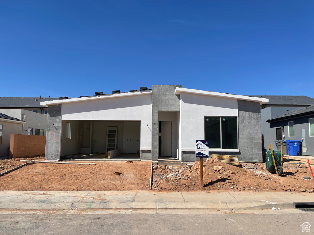 View of front of house featuring stucco siding