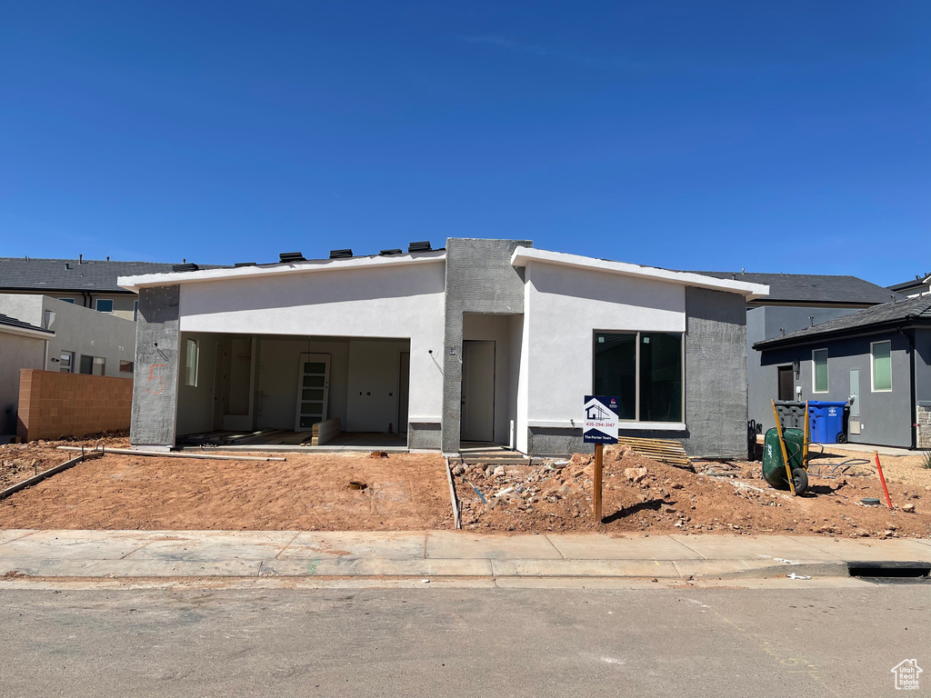 View of front of home with stucco siding