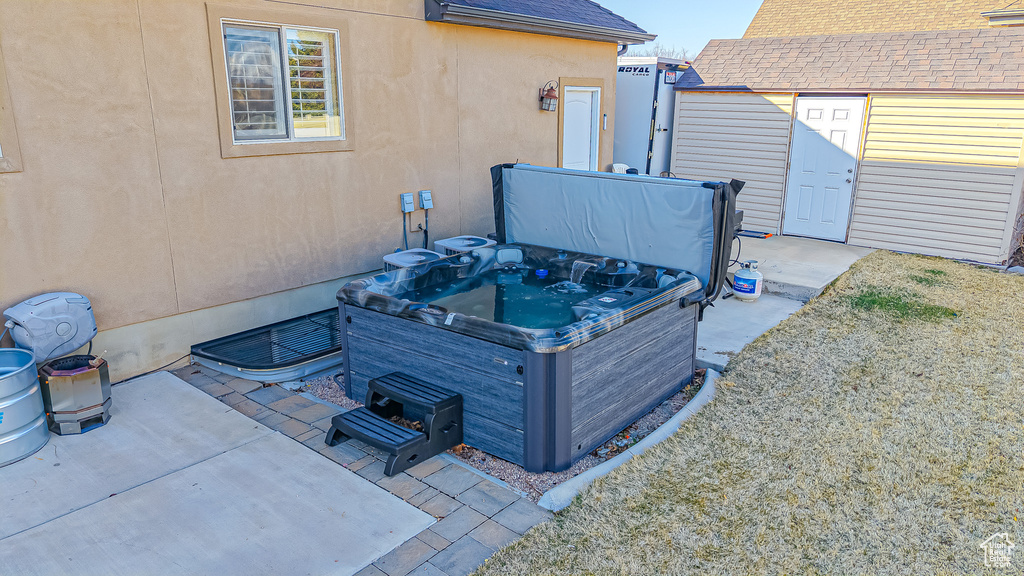 Exterior space featuring a hot tub