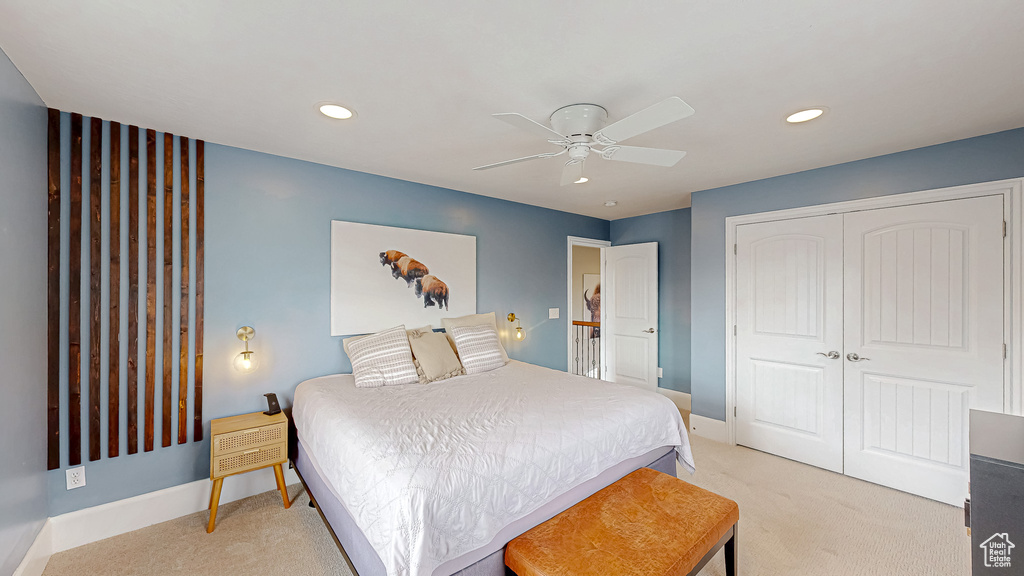 Bedroom featuring light carpet, recessed lighting, a closet, baseboards, and ceiling fan