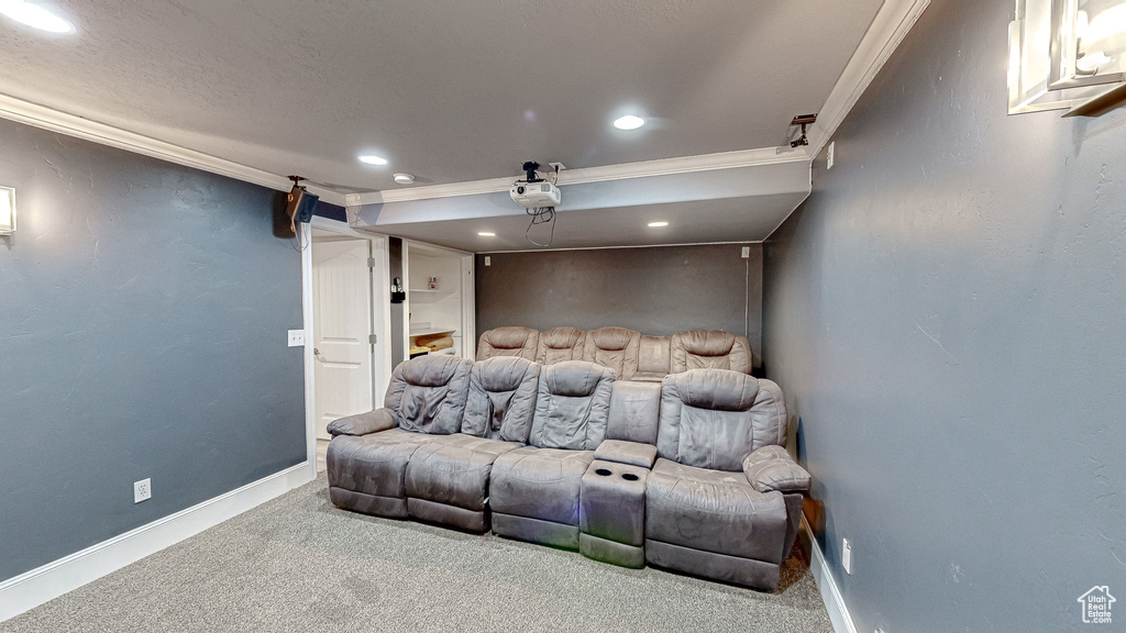 Home theater with carpet flooring, recessed lighting, baseboards, and ornamental molding