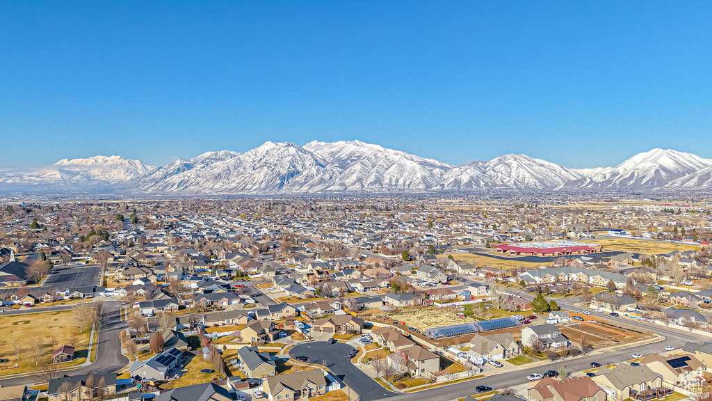 Property view of mountains with a residential view