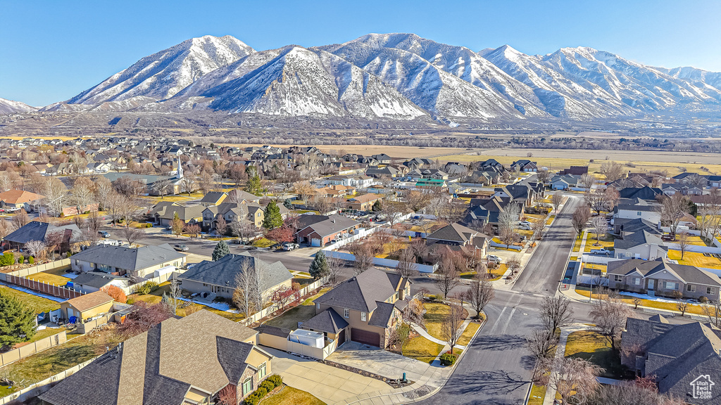 Birds eye view of property with a mountain view and a residential view