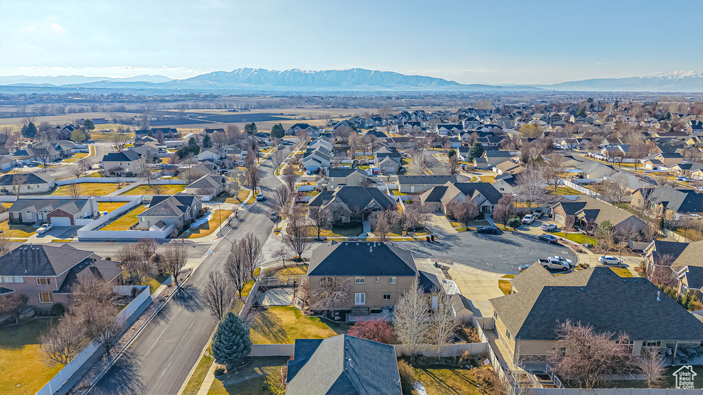 Birds eye view of property with a residential view and a mountain view