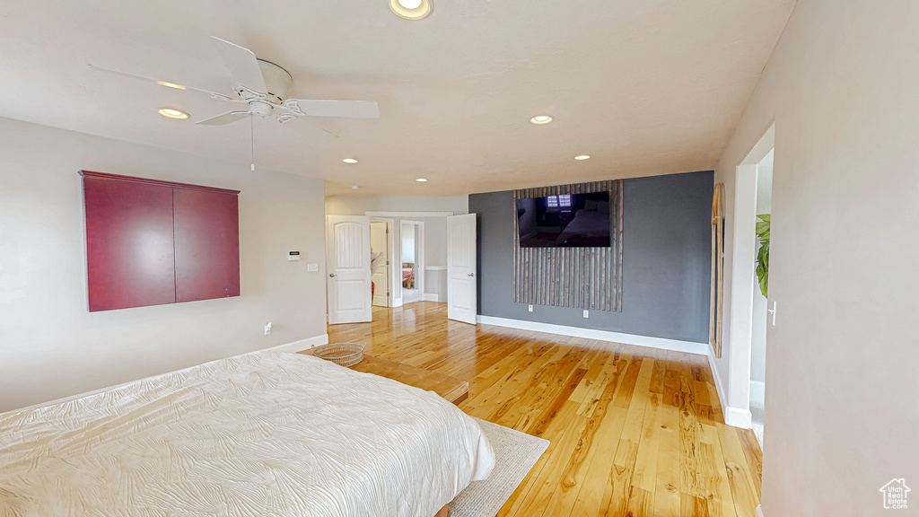 Bedroom featuring recessed lighting, baseboards, and light wood finished floors