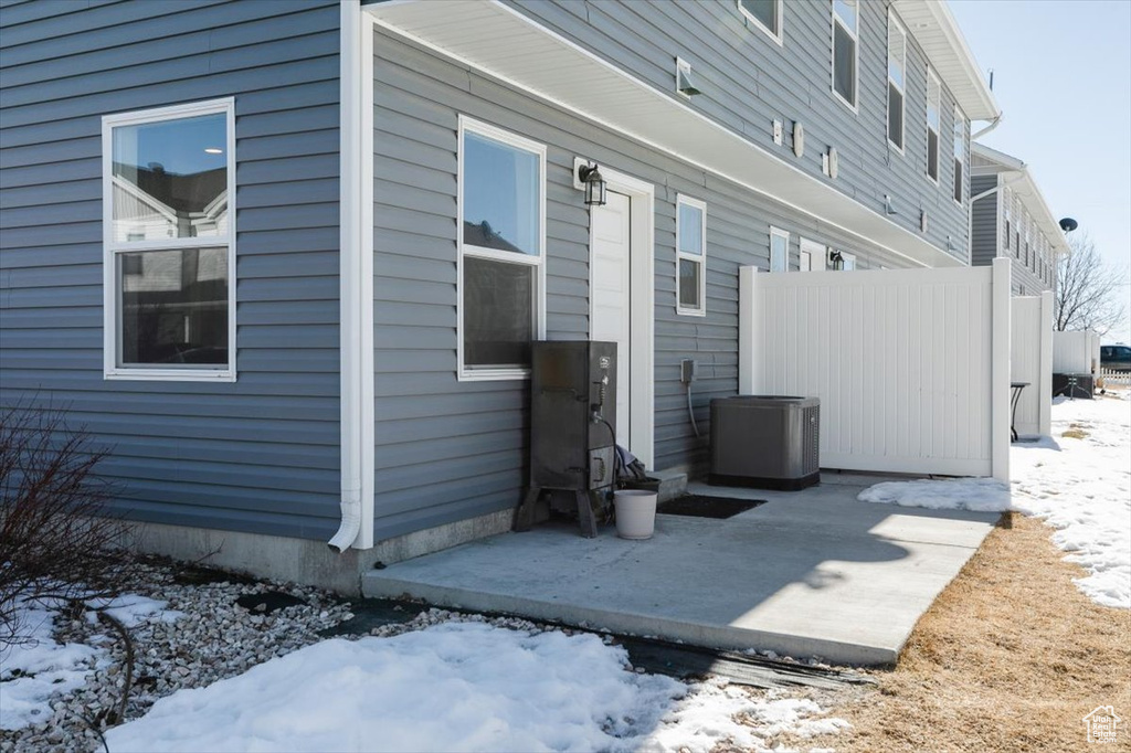 Exterior space featuring a patio and central AC unit
