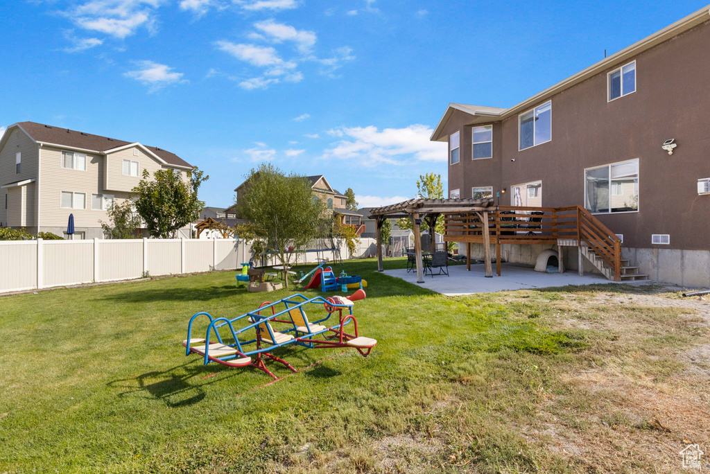 View of yard with a patio area, a residential view, a pergola, and a fenced backyard