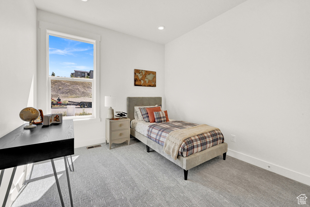 Carpeted bedroom with recessed lighting, baseboards, and visible vents