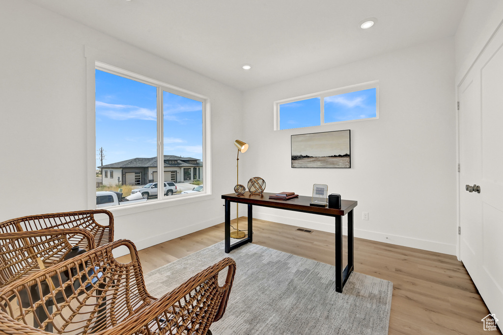 Office space with recessed lighting, baseboards, and light wood-type flooring