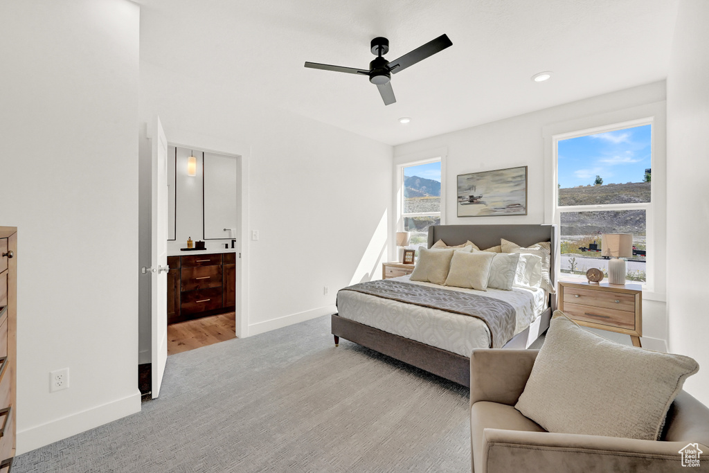 Bedroom with recessed lighting, baseboards, light carpet, and ceiling fan