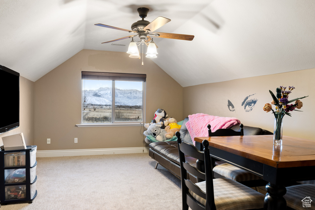 Bedroom featuring a mountain view, carpet floors, baseboards, and vaulted ceiling