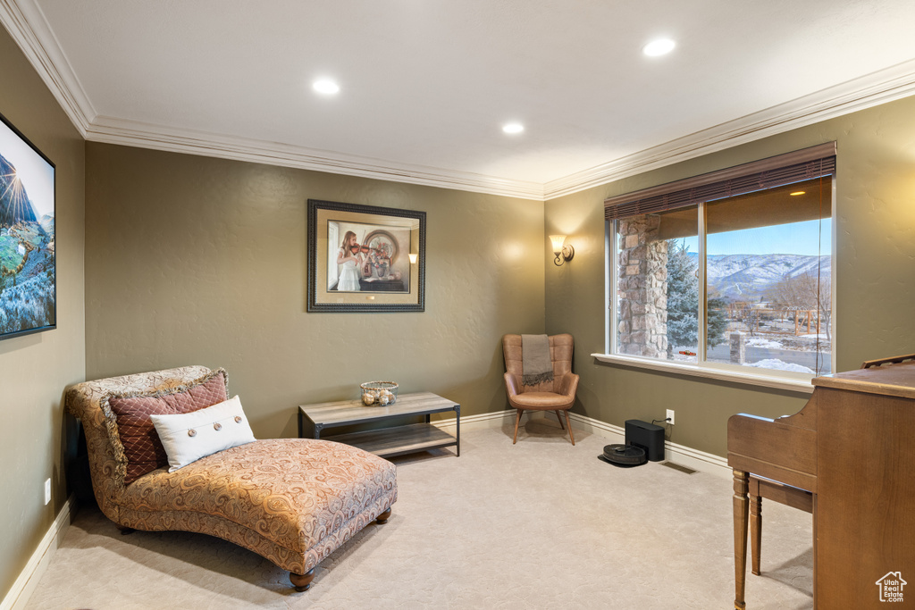 Sitting room featuring recessed lighting, ornamental molding, baseboards, and carpet floors