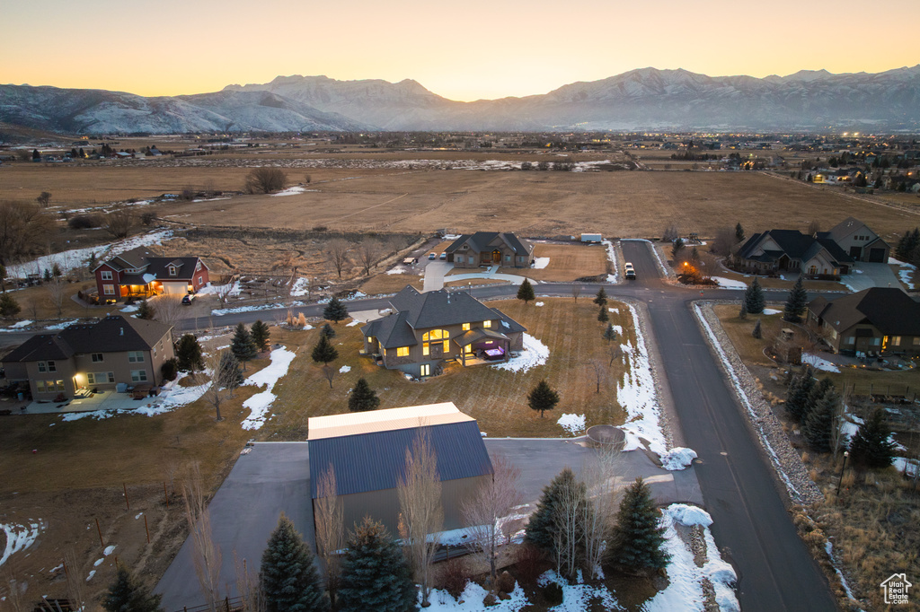 Aerial view at dusk with a residential view and a mountain view