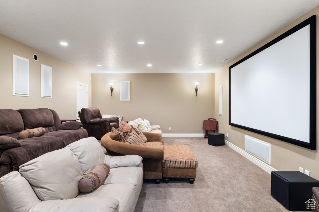 Cinema with recessed lighting, light colored carpet, and baseboards