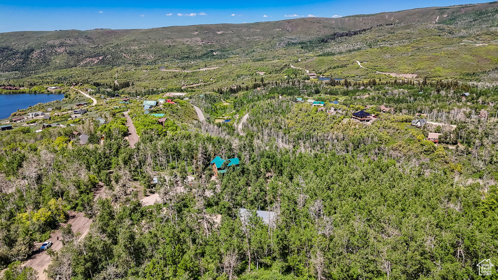View of property location featuring a water and mountain view