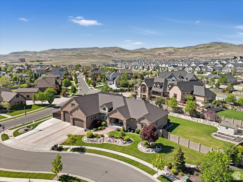 Aerial perspective of suburban area featuring a mountain backdrop