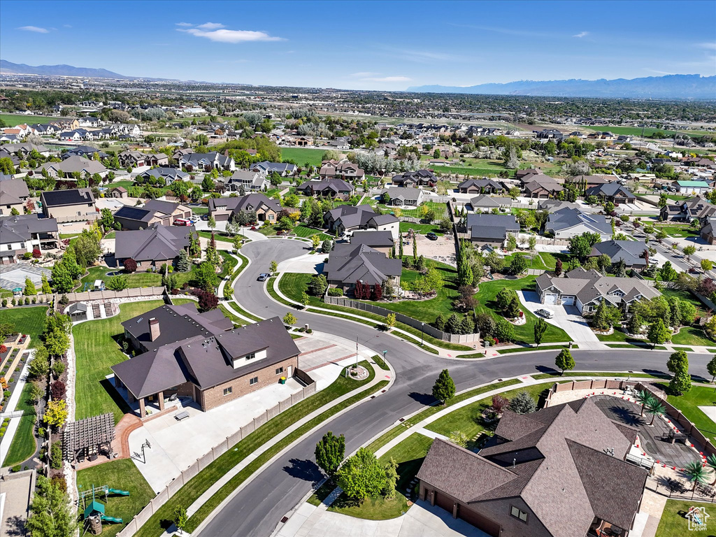 Aerial overview of property\'s location with a mountain backdrop and nearby suburban area