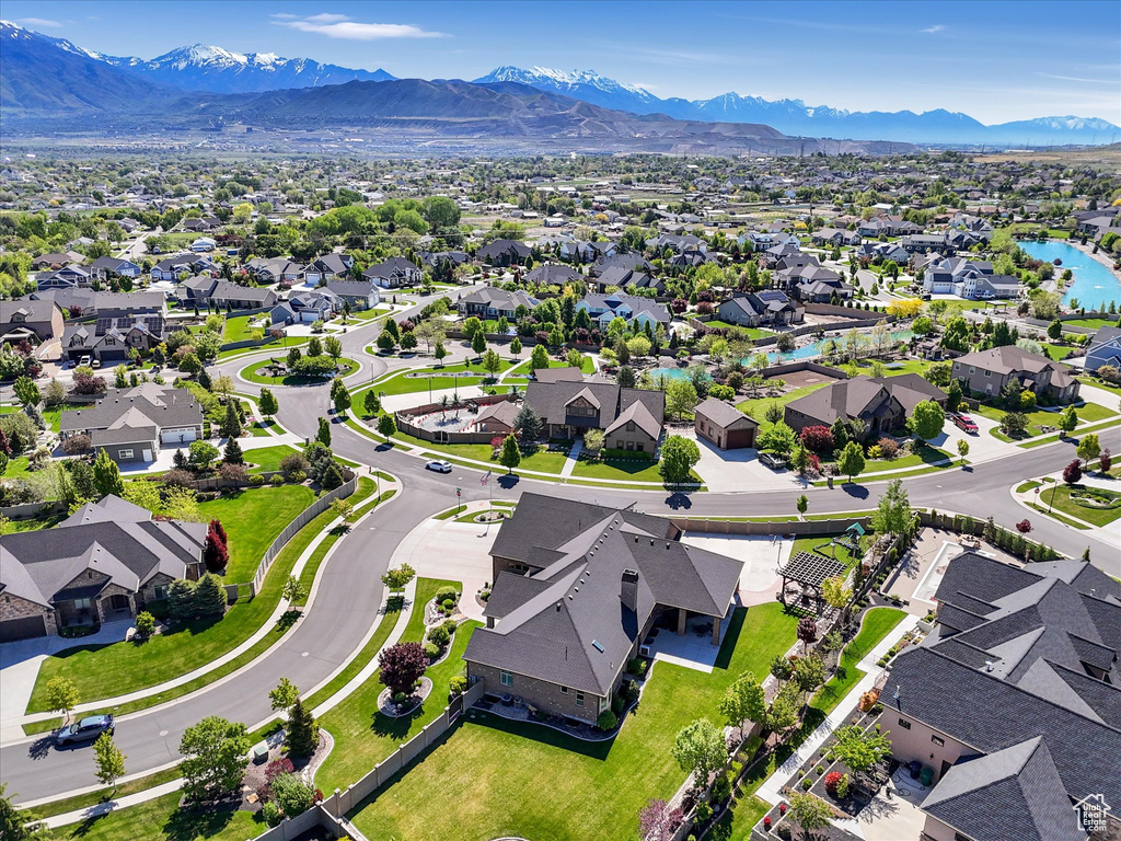 Aerial perspective of suburban area with a mountain backdrop