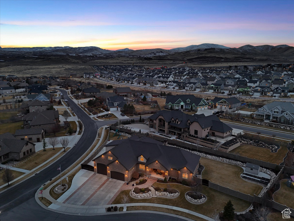 Birds eye view of property with a mountain view and a residential view