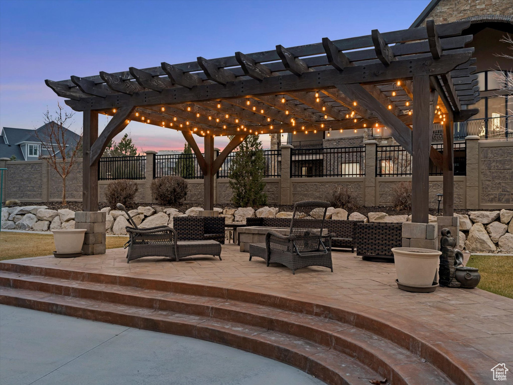 View of patio / terrace with an outdoor living space, a pergola, and fence