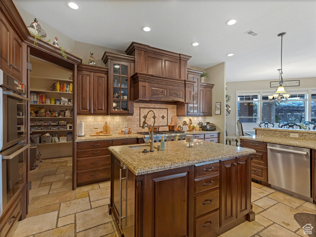 Kitchen featuring recessed lighting, stainless steel appliances, stone tile floors, and visible vents