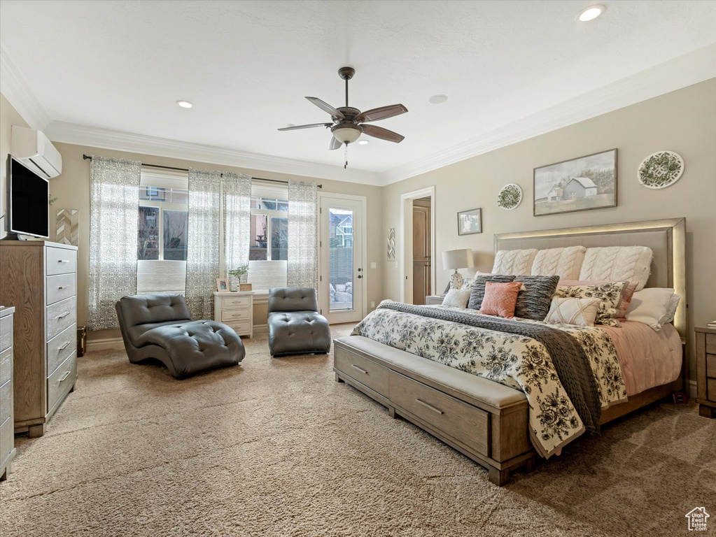 Carpeted bedroom with access to outside, a wall mounted AC, ceiling fan, and ornamental molding