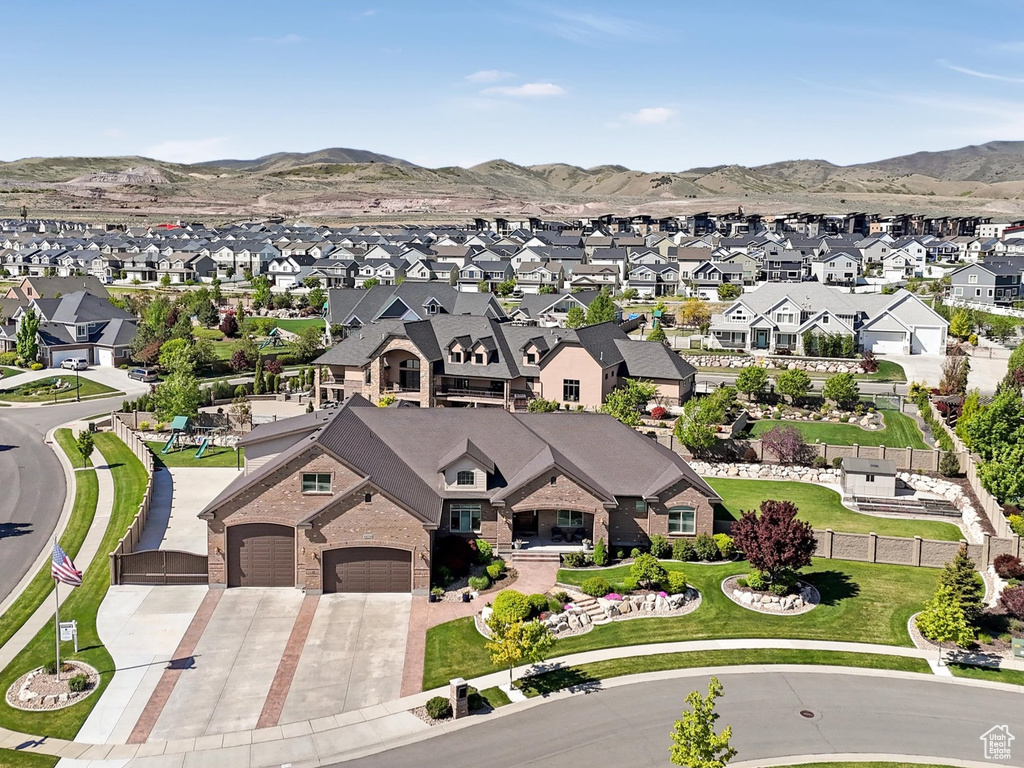 Aerial view of residential area with a mountainous background