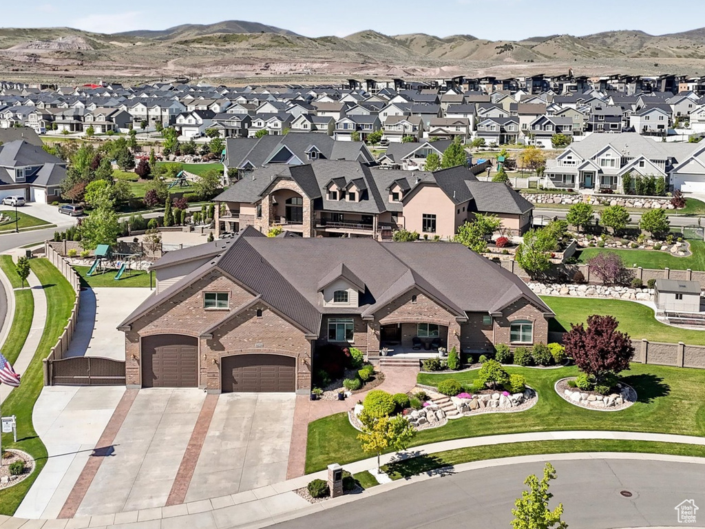 Aerial view of residential area with a mountainous background