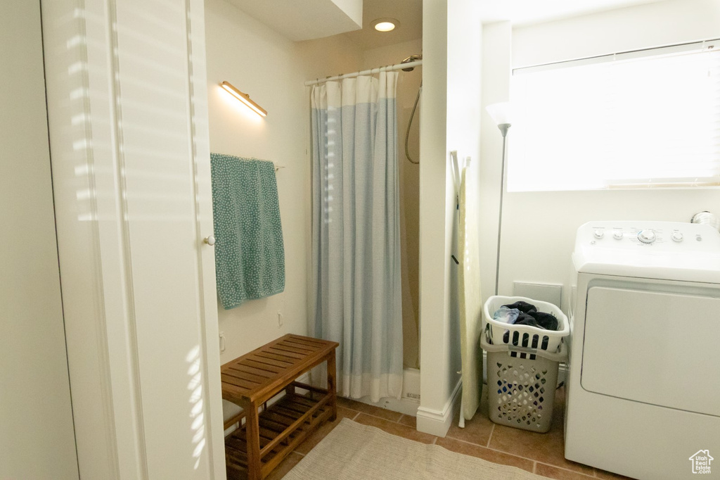 Bathroom with tile patterned flooring, washer / dryer, recessed lighting, and a shower with shower curtain