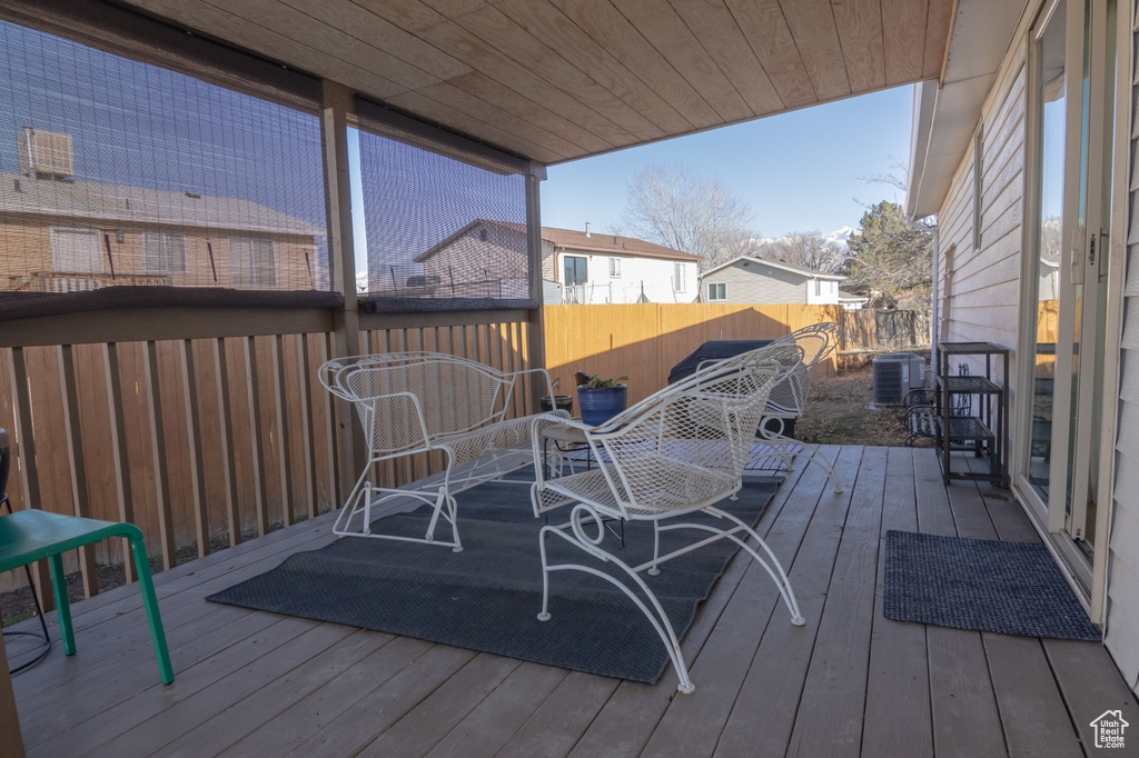 Wooden deck featuring fence