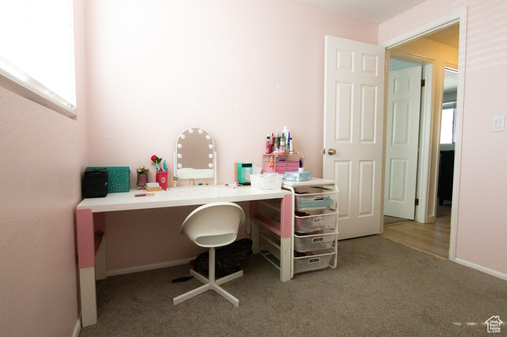 Carpeted office with baseboards