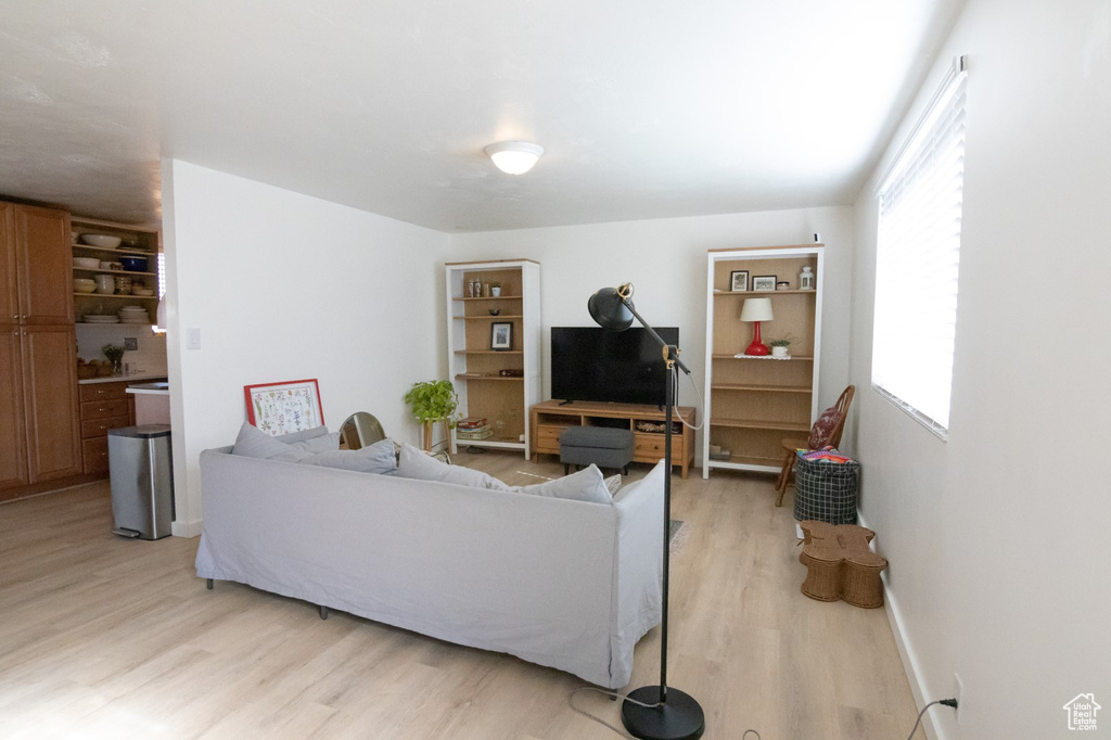 Living room featuring baseboards and light wood finished floors