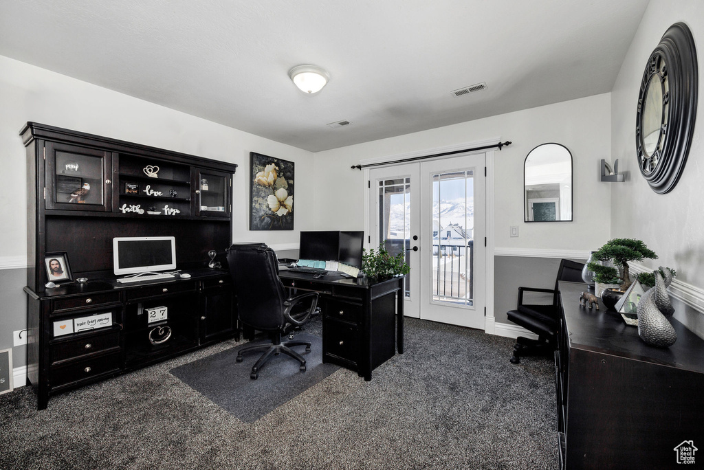 Office area with visible vents, french doors, baseboards, and dark colored carpet