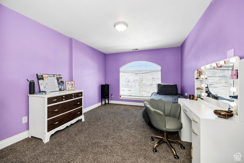 Home office with carpet and baseboards