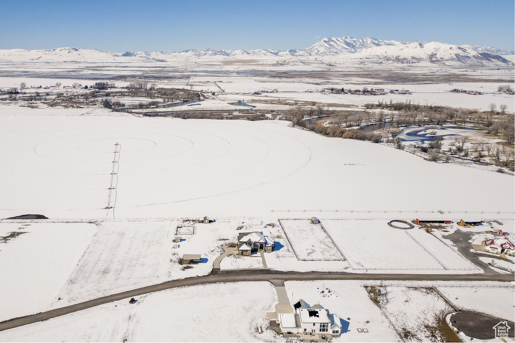 Snowy aerial view featuring a mountain view