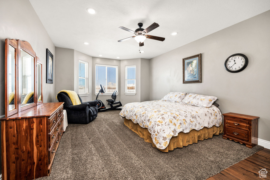 Bedroom featuring recessed lighting, a ceiling fan, baseboards, and dark wood-style flooring