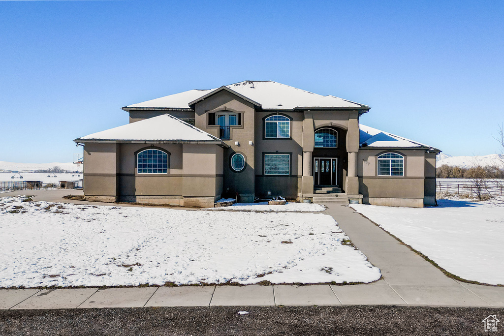 View of front of house featuring stucco siding