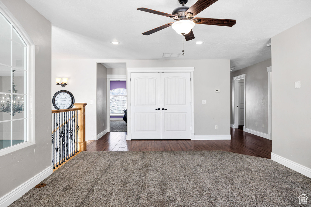 Unfurnished bedroom featuring recessed lighting, a closet, baseboards, and dark wood finished floors