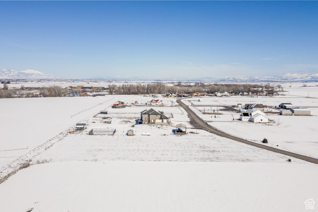 Snowy aerial view with a mountain view