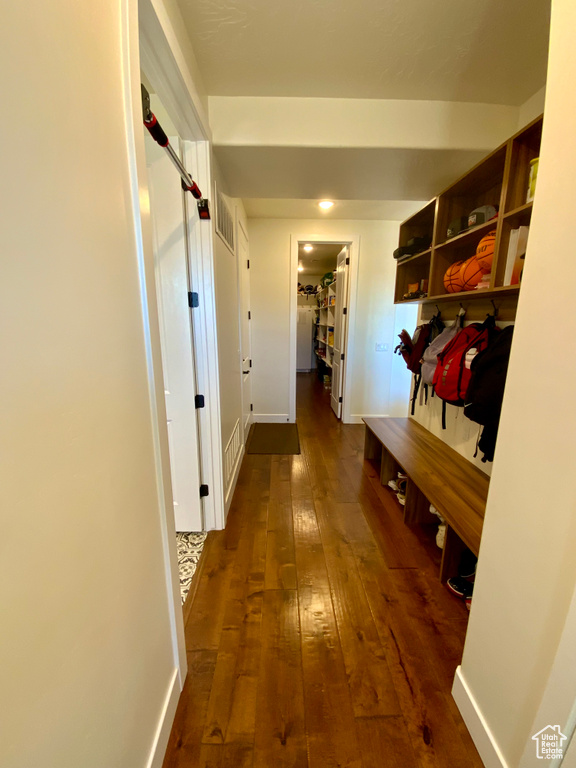 Mudroom featuring visible vents, baseboards, and dark wood-style floors