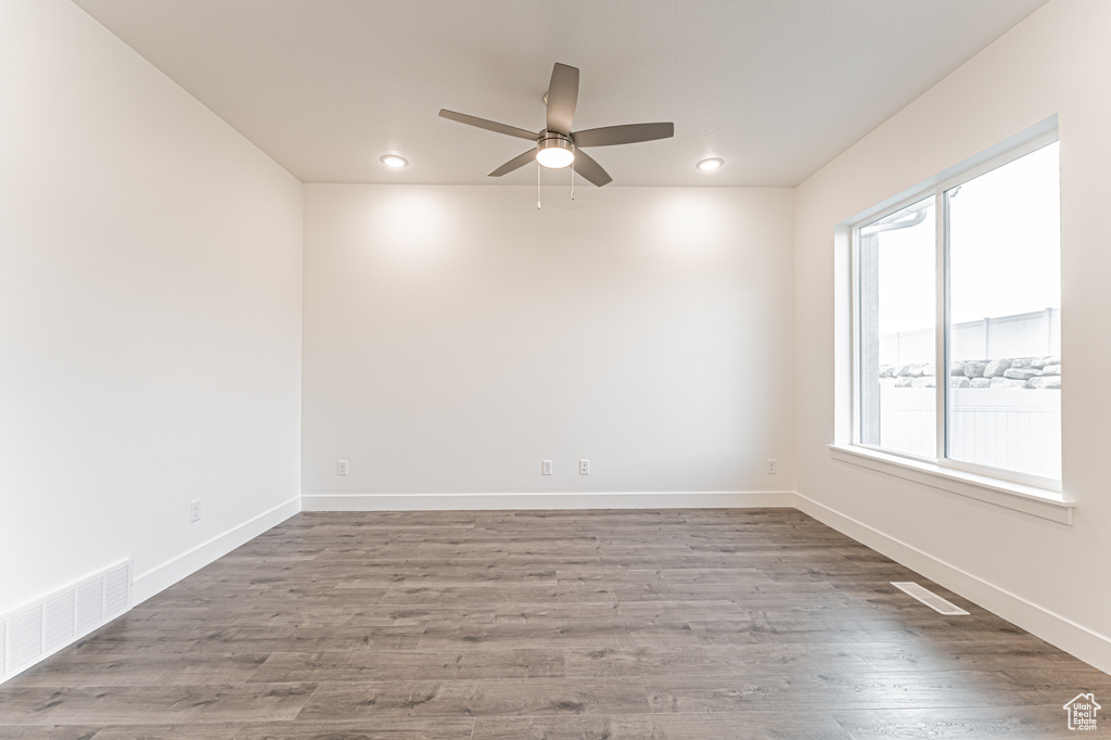 Unfurnished room with ceiling fan, recessed lighting, and wood finished floors