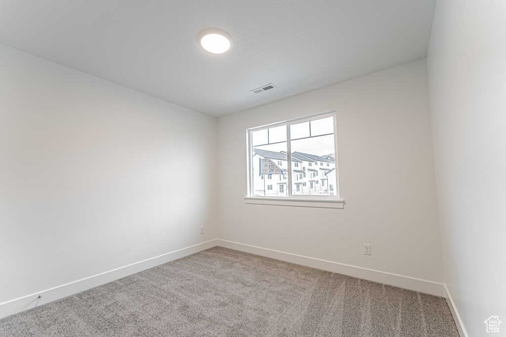 Unfurnished room featuring carpet floors