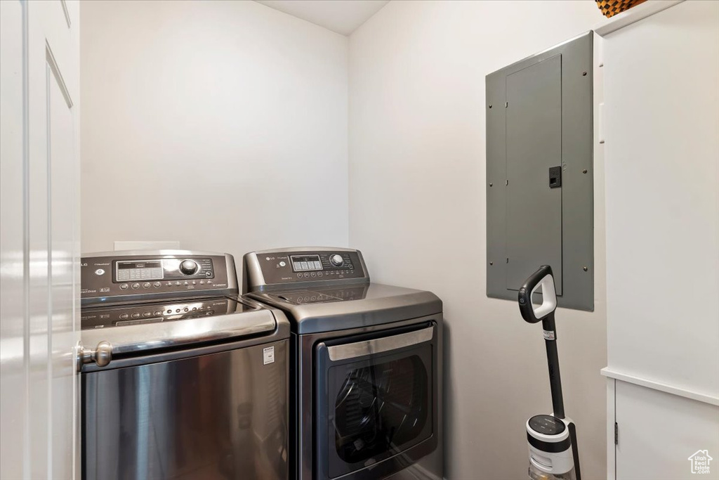 Clothes washing area with electric panel, laundry area, and washing machine and dryer