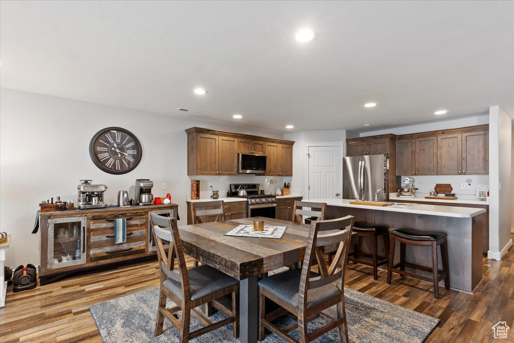 Dining room featuring visible vents, recessed lighting, and wood finished floors