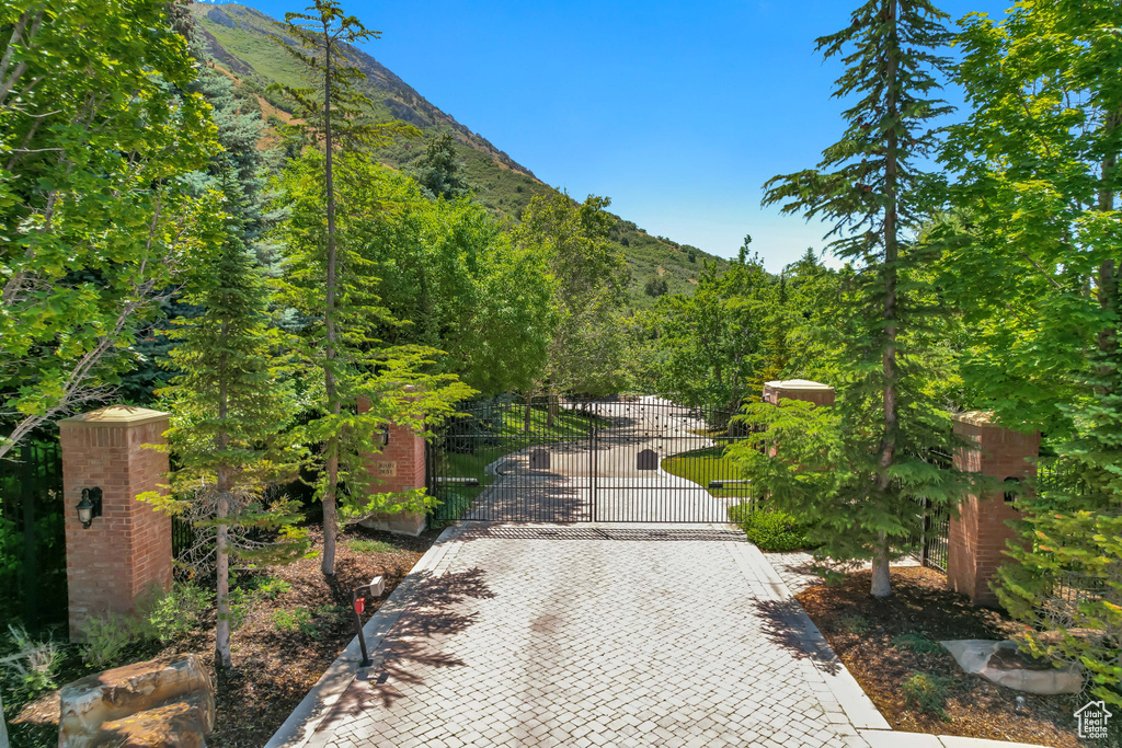 View of community with a mountain view and a gate