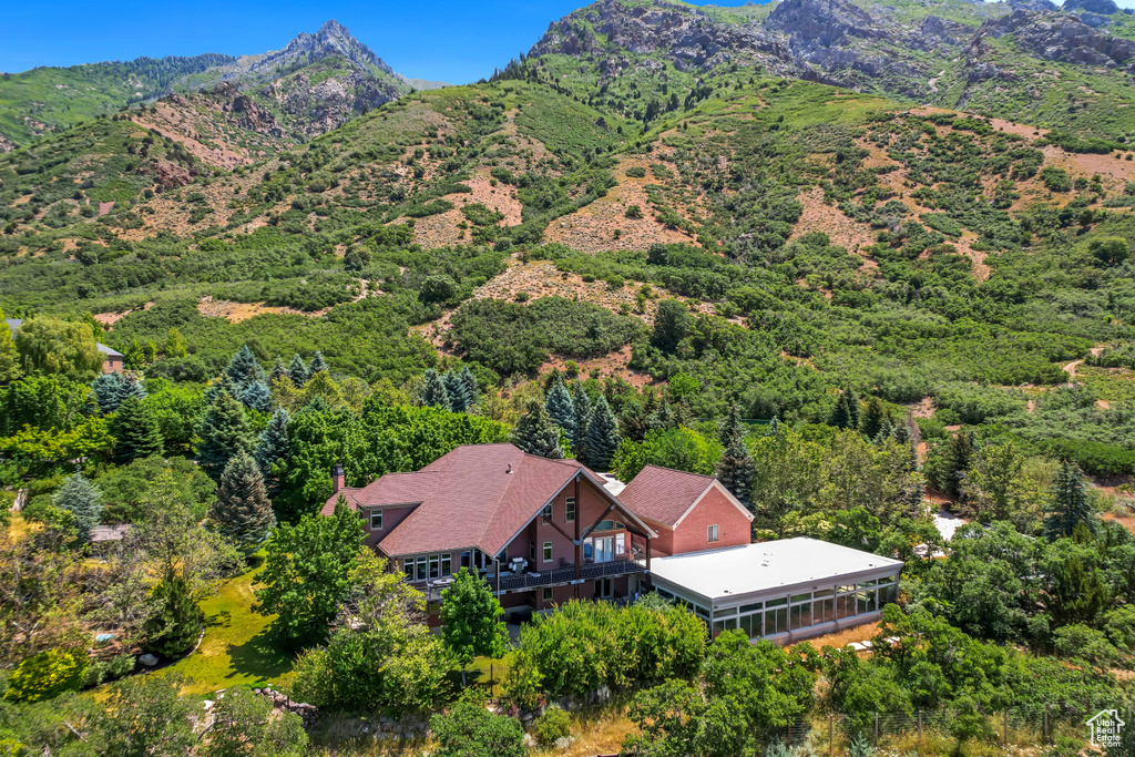 View from above of property with a mountain backdrop